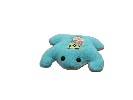 Blue plush toy held in a hand against a white background